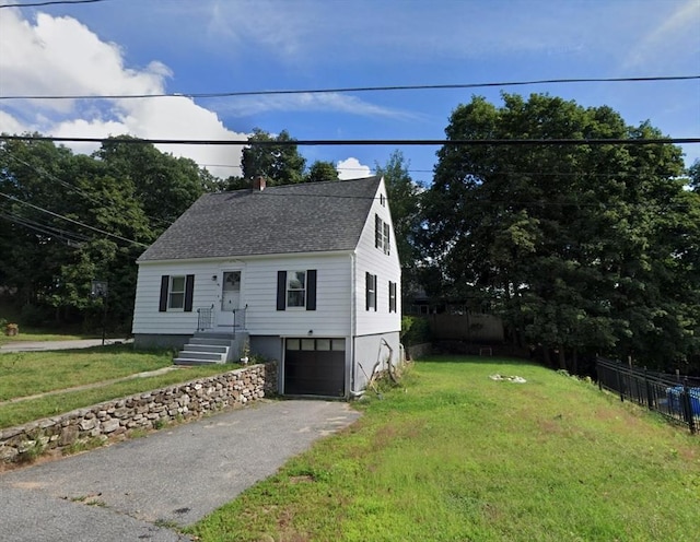 view of front facade featuring a garage and a front yard