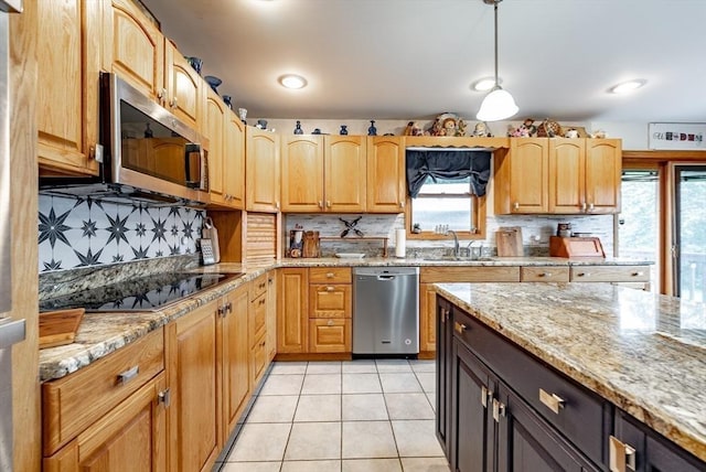 140 Sheffield Dr, Belchertown, MA 01007 - kitchen with appliances with stainless steel finishes, a sink, light stone counters, and backsplash