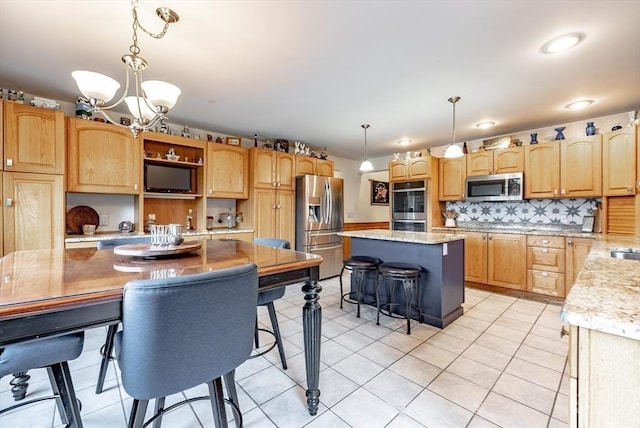 140 Sheffield Dr, Belchertown, MA 01007 - kitchen featuring stainless steel appliances, a chandelier, a kitchen island, decorative backsplash, and light stone counters