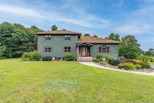 tri-level home with a front yard