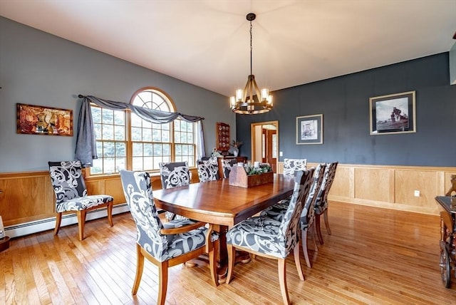 140 Sheffield Dr, Belchertown, MA 01007 - dining area with a chandelier, light wood-style flooring, wainscoting, and baseboard heating