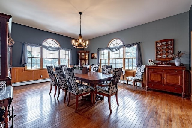 140 Sheffield Dr, Belchertown, MA 01007 - dining area with a baseboard heating unit, a chandelier, and hardwood / wood-style flooring