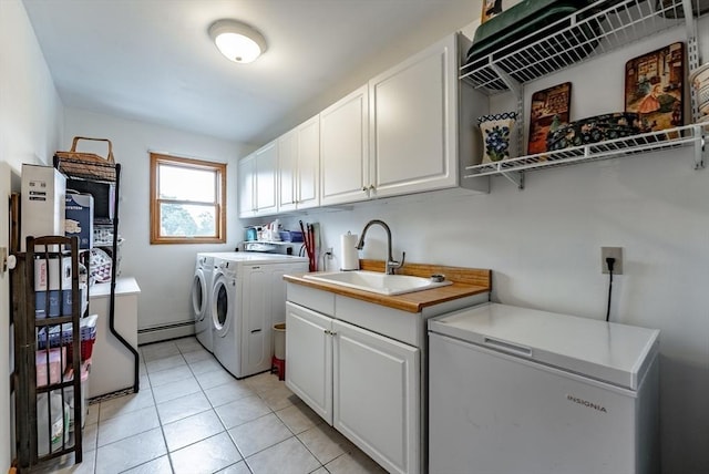140 Sheffield Dr, Belchertown, MA 01007 - laundry room with independent washer and dryer, cabinet space, light tile patterned floors, and a baseboard radiator