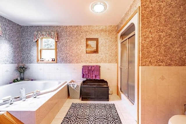 140 Sheffield Dr, Belchertown, MA 01007 - bathroom featuring tile walls, a wainscoted wall, a shower stall, tile patterned flooring, and wallpapered walls