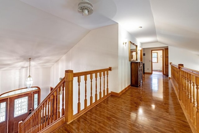 140 Sheffield Dr, Belchertown, MA 01007 - hallway with lofted ceiling, an upstairs landing, wood finished floors, baseboard heating, and baseboards