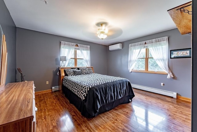 140 Sheffield Dr, Belchertown, MA 01007 - bedroom with baseboard heating, an AC wall unit, and multiple windows
