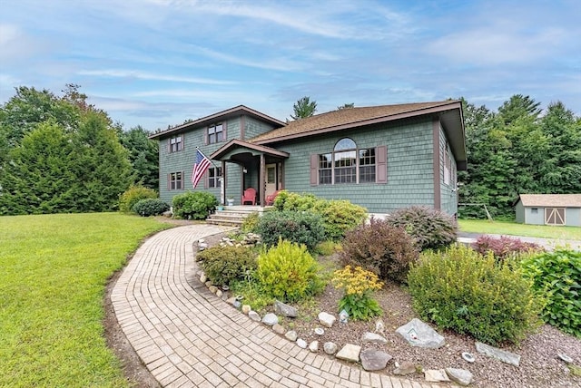 split level home with an outbuilding and a front yard