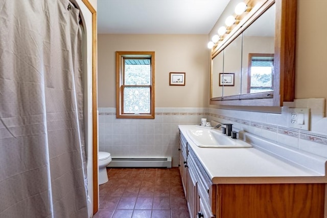 140 Sheffield Dr, Belchertown, MA 01007 - full bathroom with a baseboard radiator, tile walls, vanity, toilet, and tile patterned flooring