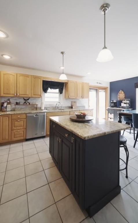 140 Sheffield Dr, Belchertown, MA 01007 - kitchen with stainless steel dishwasher, light tile patterned flooring, decorative light fixtures, light stone counters, and a center island