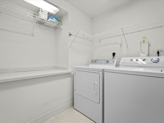 laundry room featuring laundry area and washing machine and clothes dryer