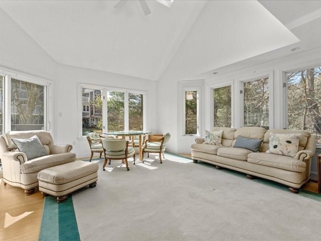 sunroom featuring ceiling fan and vaulted ceiling