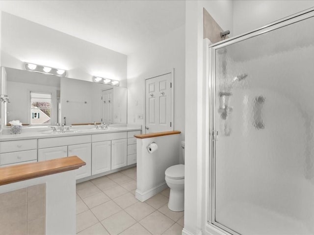 bathroom featuring a sink and a shower stall