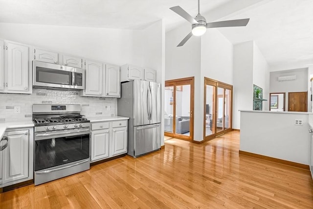 75 Winter St, Hopkinton, MA 01748 - kitchen with stainless steel appliances, french doors, backsplash, a ceiling fan, and light countertops