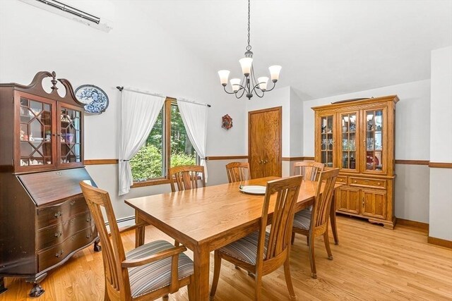 75 Winter St, Hopkinton, MA 01748 - dining room with a chandelier, light wood-style flooring, and high vaulted ceiling