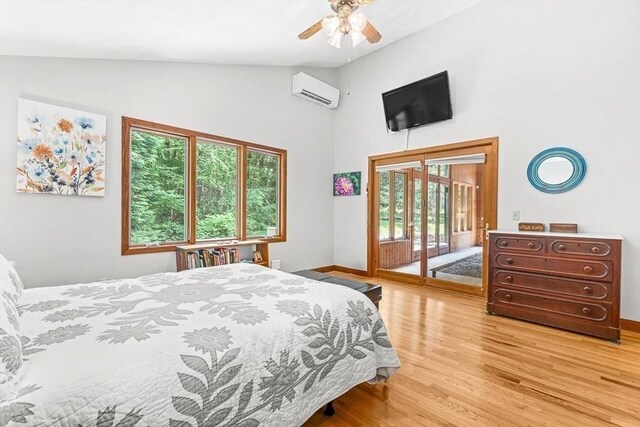 75 Winter St, Hopkinton, MA 01748 - bedroom with access to exterior, a wall unit AC, light wood-type flooring, high vaulted ceiling, and a ceiling fan