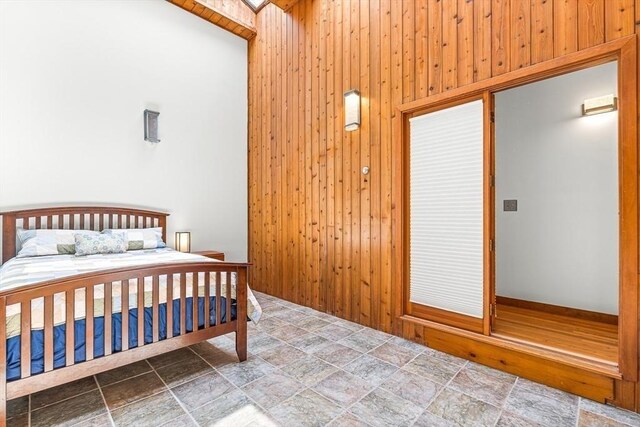 75 Winter St, Hopkinton, MA 01748 - bedroom featuring stone finish floors and wooden walls