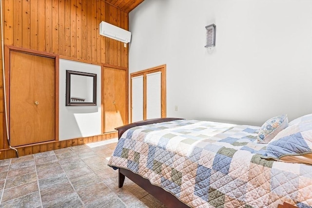 75 Winter St, Hopkinton, MA 01748 - bedroom with high vaulted ceiling, wooden ceiling, wooden walls, stone finish flooring, and a wall mounted AC