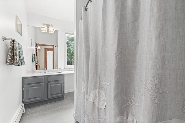 75 Winter St, Hopkinton, MA 01748 - full bath with a baseboard radiator, vanity, tile patterned floors, and a shower with curtain