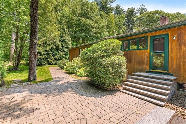 75 Winter St, Hopkinton, MA 01748 - view of front of property featuring entry steps and a chimney