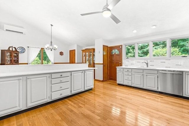 75 Winter St, Hopkinton, MA 01748 - kitchen with dishwasher, a wall mounted air conditioner, light countertops, a chandelier, and gray cabinets