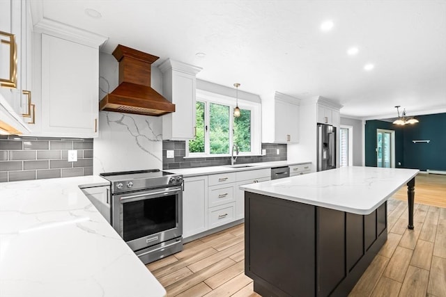 7 Evergreen Cir, Sterling, MA 01564 - kitchen featuring appliances with stainless steel finishes, premium range hood, white cabinets, decorative backsplash, and recessed lighting