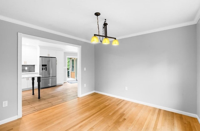 7 Evergreen Cir, Sterling, MA 01564 - unfurnished living room featuring ornamental molding and light wood-type flooring