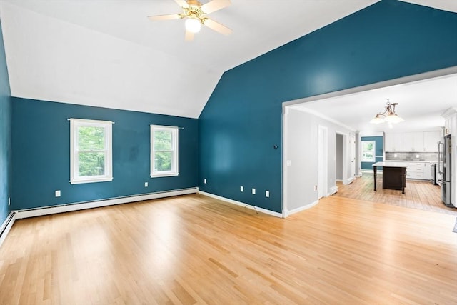 7 Evergreen Cir, Sterling, MA 01564 - unfurnished living room with a ceiling fan, light wood-style flooring, a chandelier, baseboard heating, and vaulted ceiling