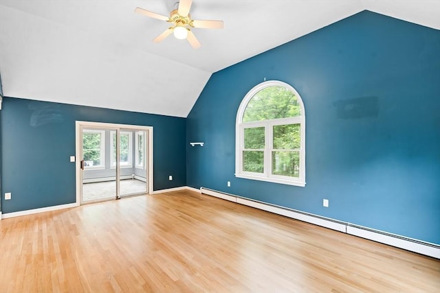 7 Evergreen Cir, Sterling, MA 01564 - unfurnished living room featuring a baseboard heating unit, lofted ceiling, wood finished floors, and healthy amount of natural light