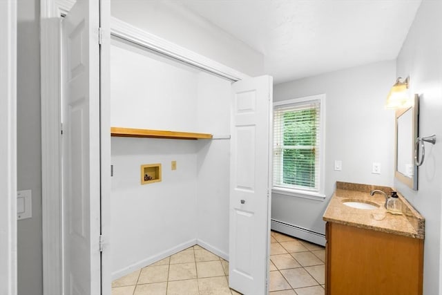 7 Evergreen Cir, Sterling, MA 01564 - laundry room with washer hookup, baseboard heating, and light tile patterned floors