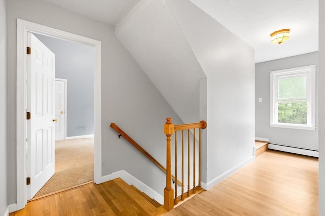 7 Evergreen Cir, Sterling, MA 01564 - hall featuring an upstairs landing, a baseboard radiator, light wood-style flooring, and lofted ceiling