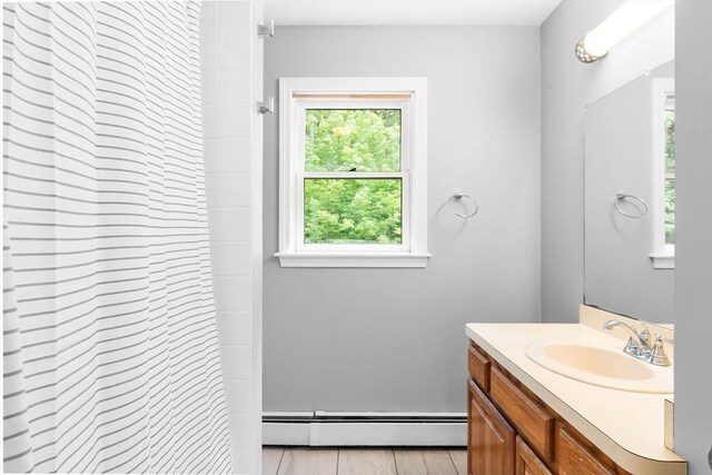 7 Evergreen Cir, Sterling, MA 01564 - full bath featuring a baseboard radiator, vanity, and curtained shower