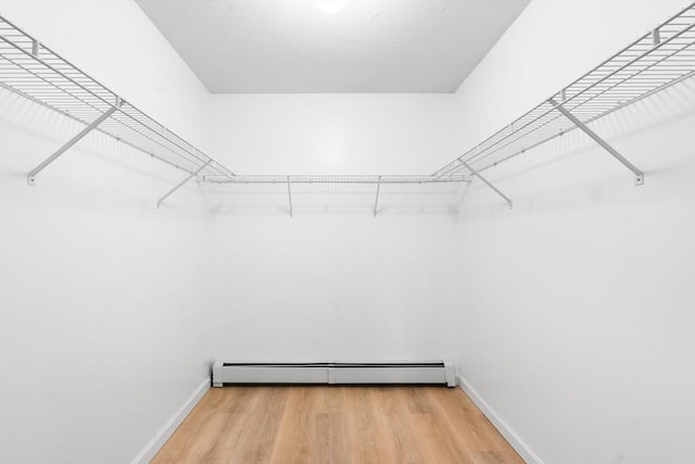 7 Evergreen Cir, Sterling, MA 01564 - spacious closet with a baseboard heating unit and light wood-style floors