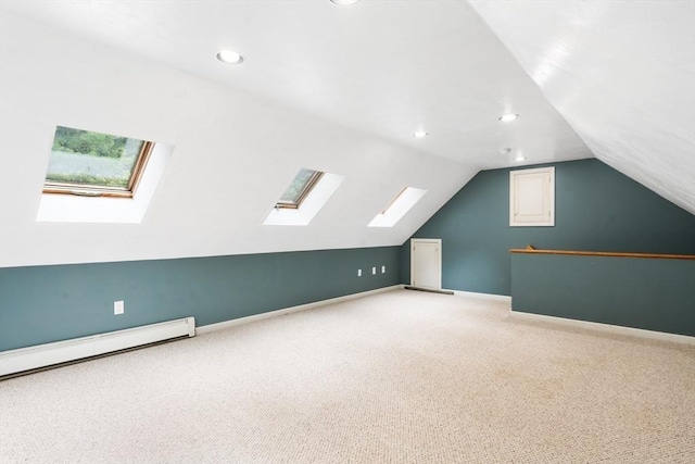 7 Evergreen Cir, Sterling, MA 01564 - bonus room with a skylight, vaulted ceiling, light carpet, a baseboard radiator, and recessed lighting