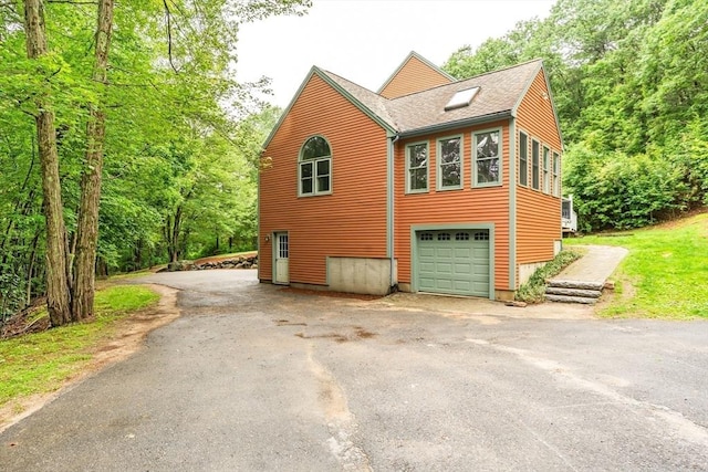 7 Evergreen Cir, Sterling, MA 01564 - view of side of property with driveway and roof with shingles