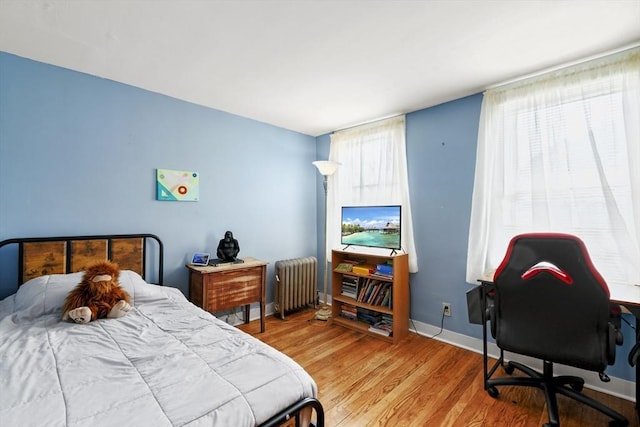 127 Carson Ave, Dalton, MA 01226 - bedroom with radiator heating unit, wood finished floors, baseboards, and a desk