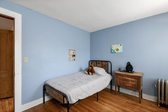 127 Carson Ave, Dalton, MA 01226 - bedroom featuring radiator heating unit, wood finished floors, and baseboards