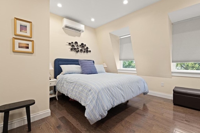 125 Heath St, Somerville, MA 02145 - bedroom featuring an AC wall unit, wood finished floors, and recessed lighting