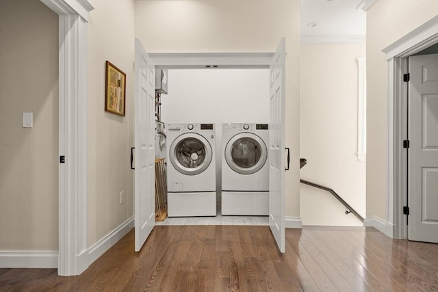 125 Heath St, Somerville, MA 02145 - laundry area with independent washer and dryer and wood finished floors