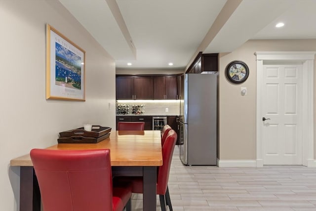 125 Heath St, Somerville, MA 02145 - dining space featuring light wood-type flooring, recessed lighting, and beverage cooler
