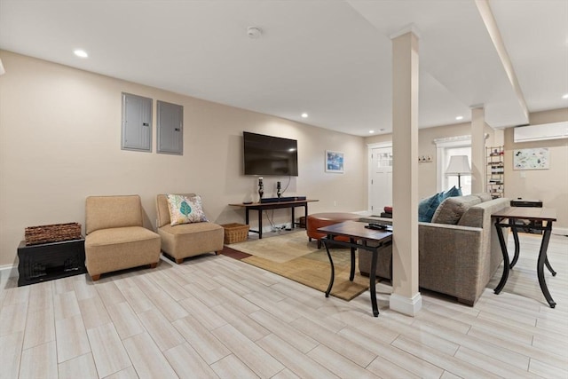 125 Heath St, Somerville, MA 02145 - living room with electric panel, light wood-type flooring, and recessed lighting
