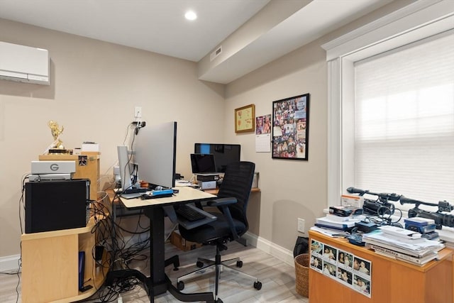125 Heath St, Somerville, MA 02145 - office space featuring a wall unit AC, light wood-style floors, and recessed lighting