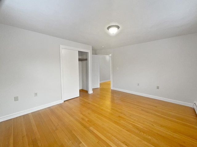 unfurnished bedroom with hardwood / wood-style flooring