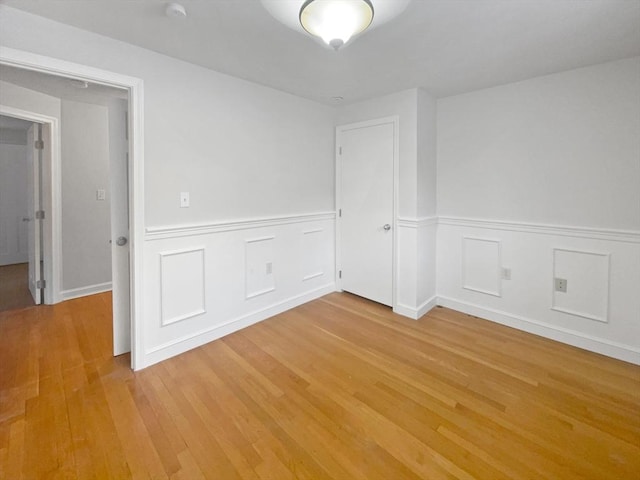 spare room with light hardwood / wood-style floors