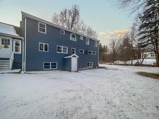 view of snow covered house