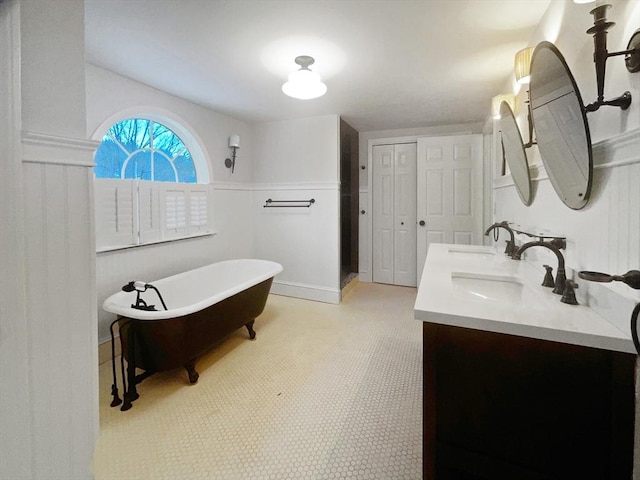 bathroom featuring vanity and a bathing tub