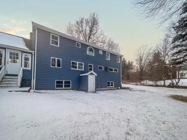 view of snow covered house