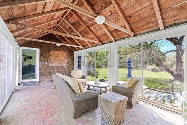 sunroom with vaulted ceiling and wooden ceiling