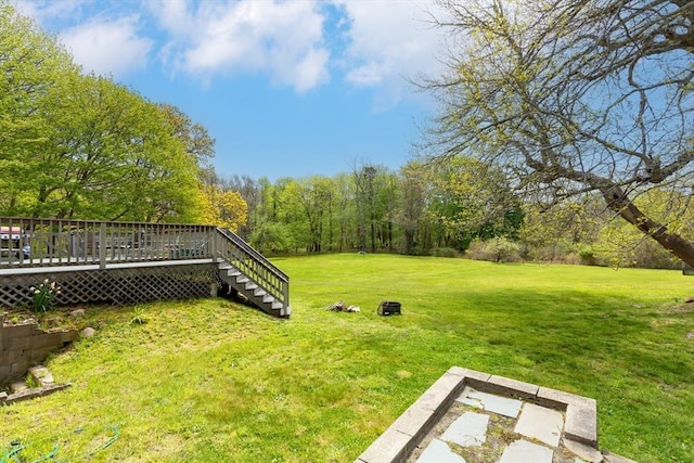 view of yard with a deck