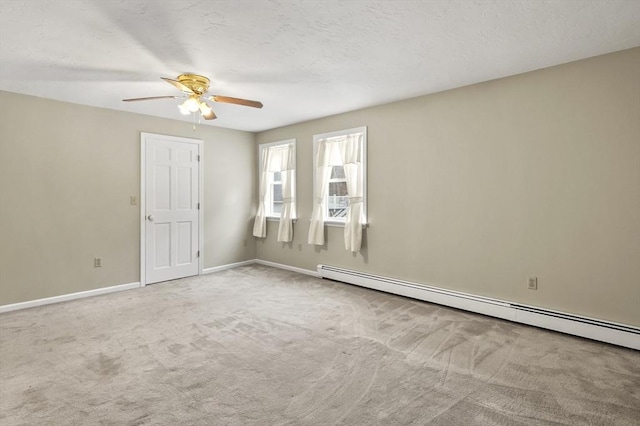 184 Burlingame Rd, Charlton, MA 01507 - empty room featuring a baseboard heating unit, a ceiling fan, carpet flooring, and baseboards