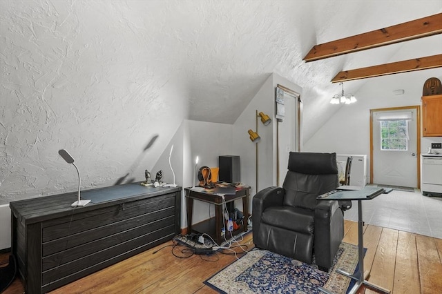 184 Burlingame Rd, Charlton, MA 01507 - sitting room with vaulted ceiling with beams, a textured ceiling, and light wood-style flooring